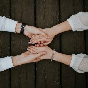 A couple holding hands and learning to create healthy habits after couples therapy in Katy, TX 77494