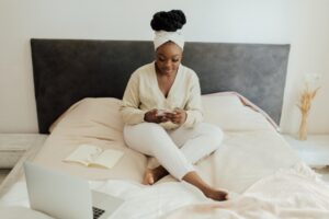 Woman sitting on her bed, good habits prompted during the pandemic blog, locke counseling and consulting, begin therapy today in katy texas, richmond texas, fulshear texas, 5 Pandemic Habits Worth Starting