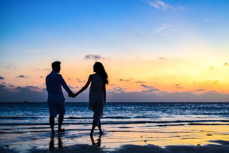 Couple holding hands on the beach, how to improve your personal life blog, locke counseling and consulting, begin therapy today in katy texas, richmond texas, fulshear texas.