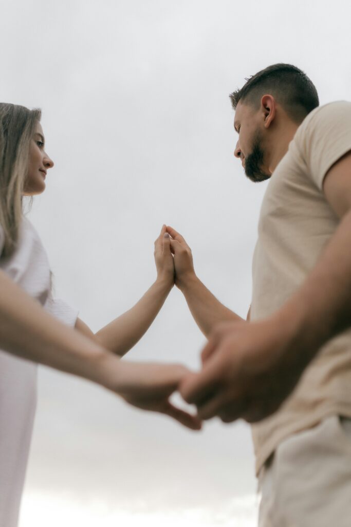 A man and woman holding hands. Represents emotional intimacy in relationships in Katy, Texas 77494