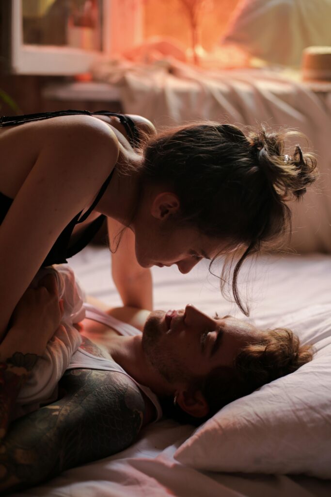A woman laying on top of a man. Represents how to rebuild intimacy in relationships in Texas.